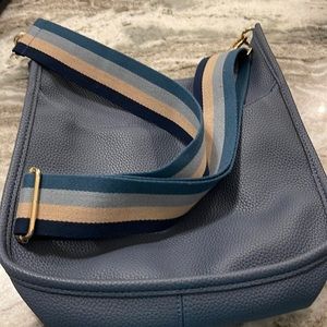 Guitar strap handbag. Like new. Blue with 2 straps.